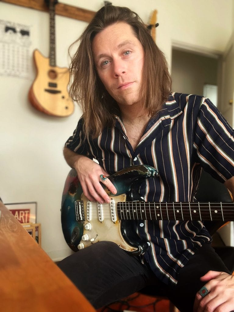 Displays Tyler Connaghan - guitar player and writer